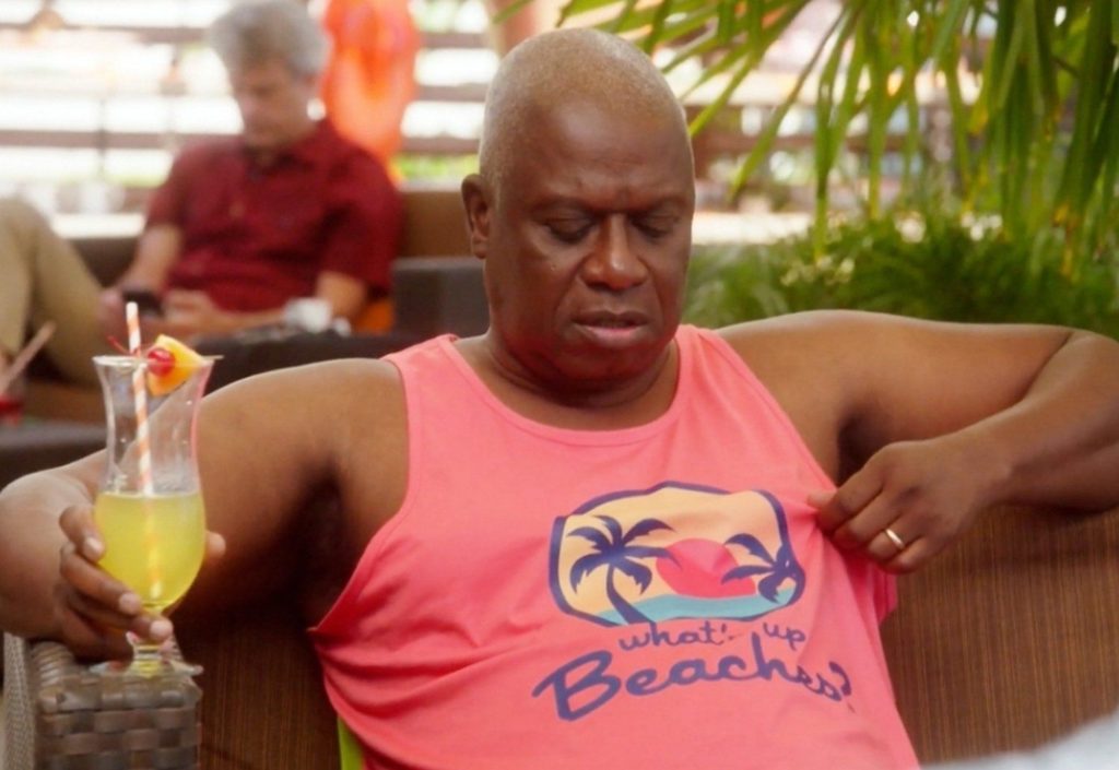 Captain Holt from Brooklyn 99 in a t-shirt that says What's Up Beaches.