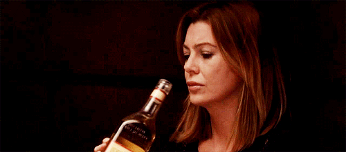 Grey's Anatomy Meredith drinking from tequila bottle.